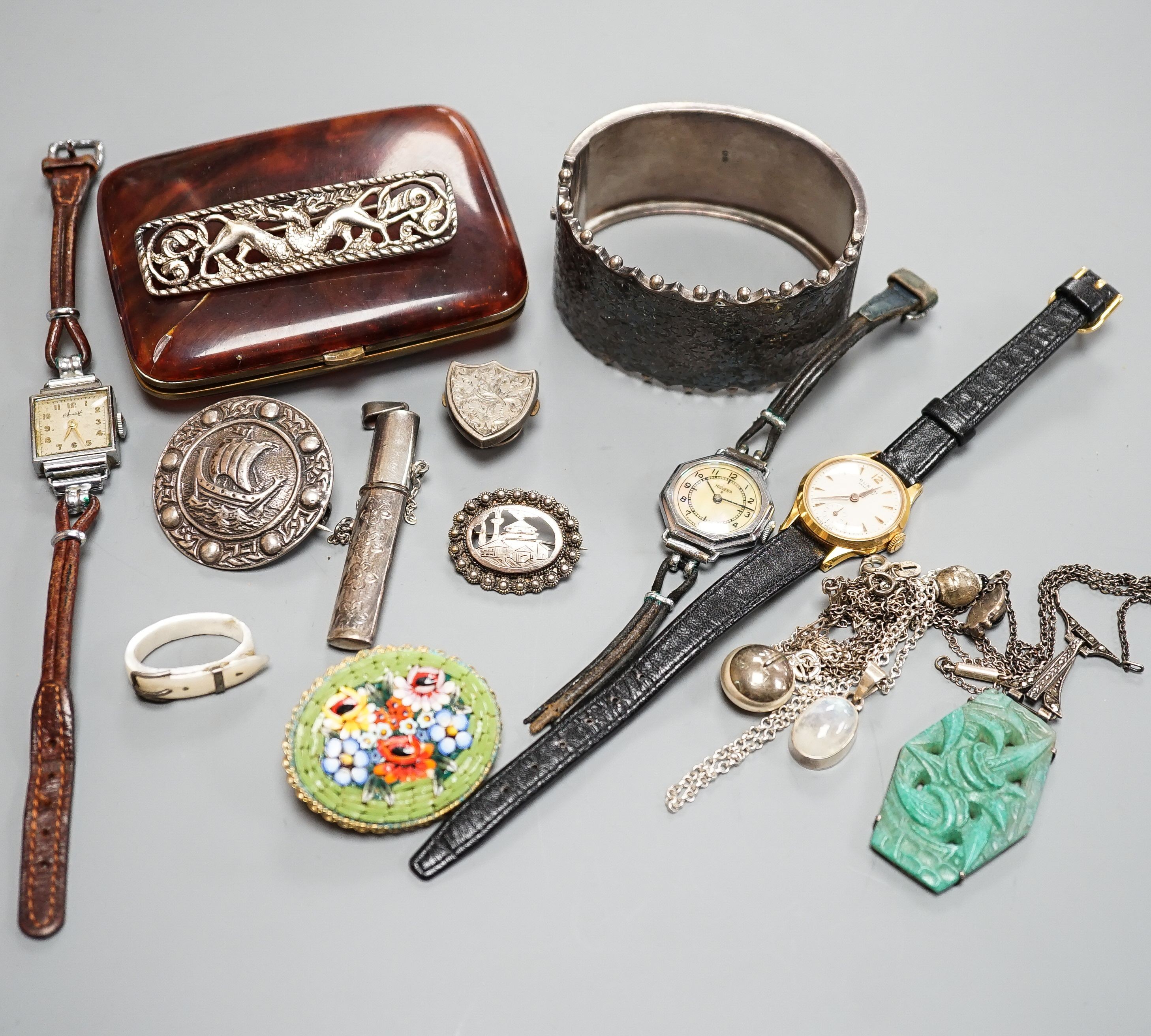 An engraved silver bangle, two silver brooches, including Scottish, two lady's wrist watches and a small group of minor jewellery, etc.
